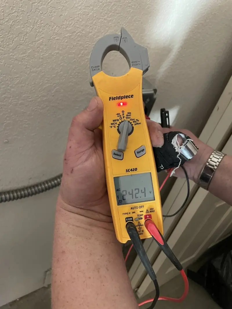 Voltage testing with clamp meter during Electrical Installation Services in Balm